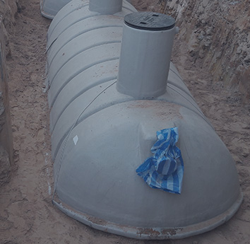 Modern septic tanks in the ground being prepared to be covered