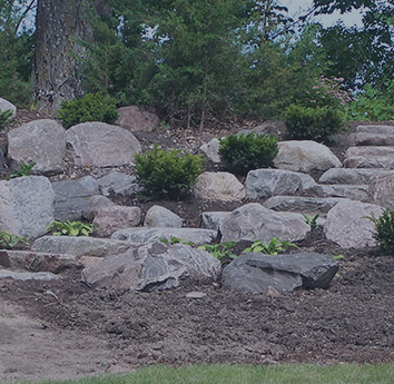 Fieldstone Boulder landscape with cut boulder steps